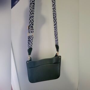 Army green vegan leather crossbody purse with animal print strap.